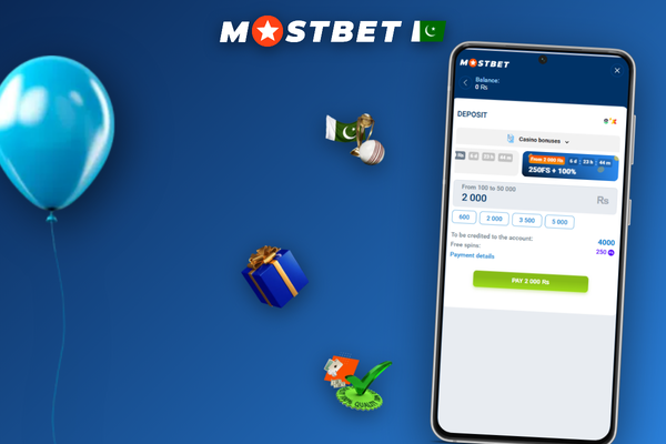 Mostbet cash agent using a smartphone cashier app at a counter in Pakistan